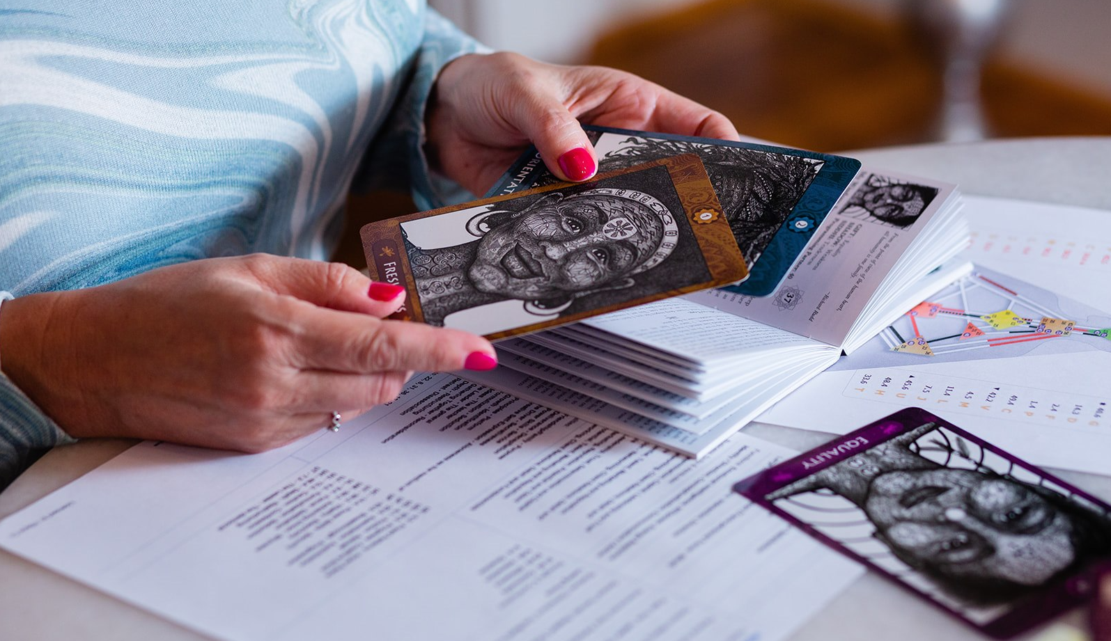 The Tools Behind Pattern Weaving Hands exploring oracle cards alongside a Human Design chart.