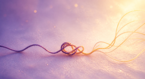 Thread, Knot, and Possibility A purple thread forms a knot, symbolizing feeling stuck in life, before loosening into flowing golden strands